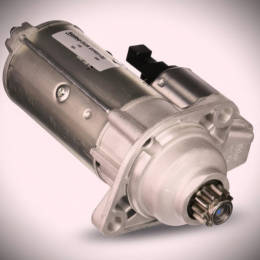 A silver metallic automotive starter motor with a black terminal connector and a metal splined output shaft, shown on a light pinkish-gray gradient background.